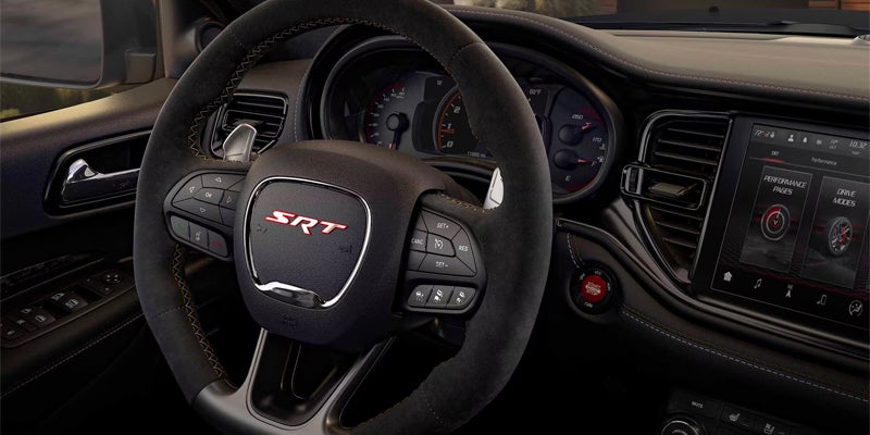 A detailed close-up shot of a Dodge engine, showcasing the high-performance engineering designed for tough conditions.