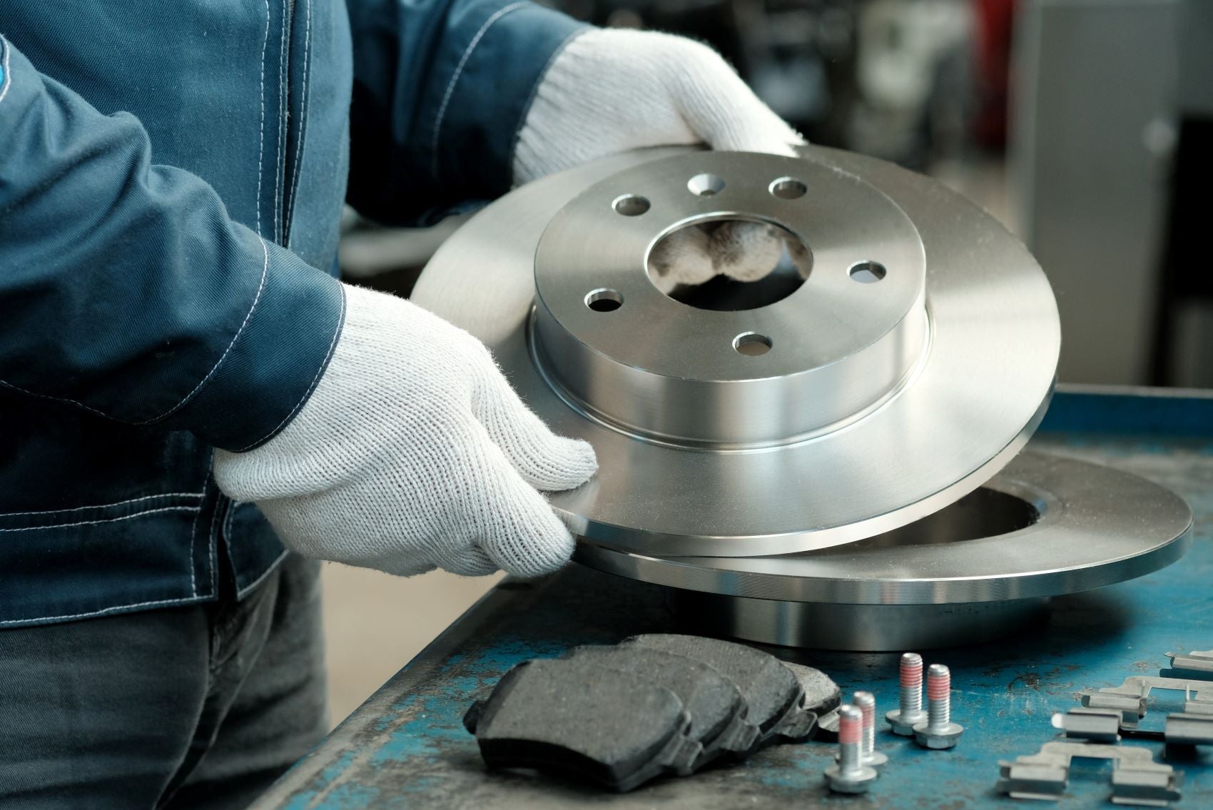 Mechanic working with brake pads