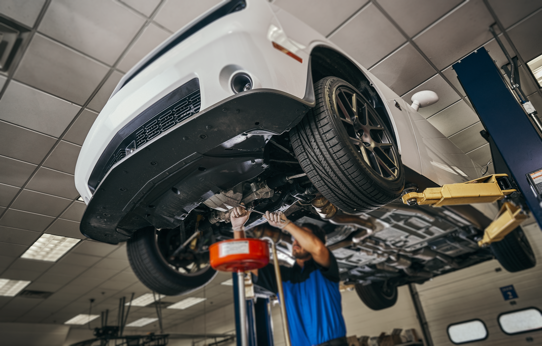 Service technician doing oil change